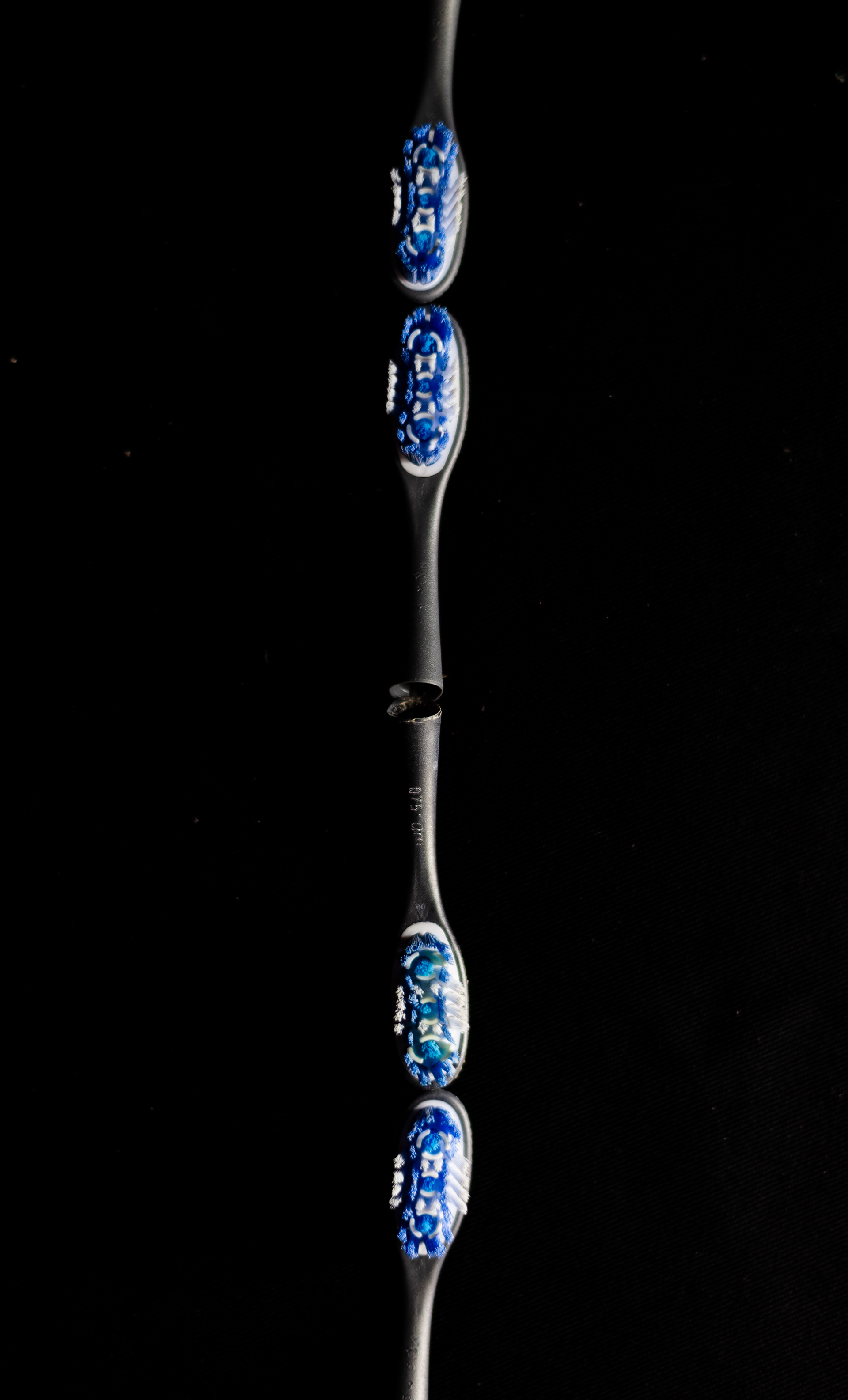 Several toothbrush heads like head to head to make a chain.
